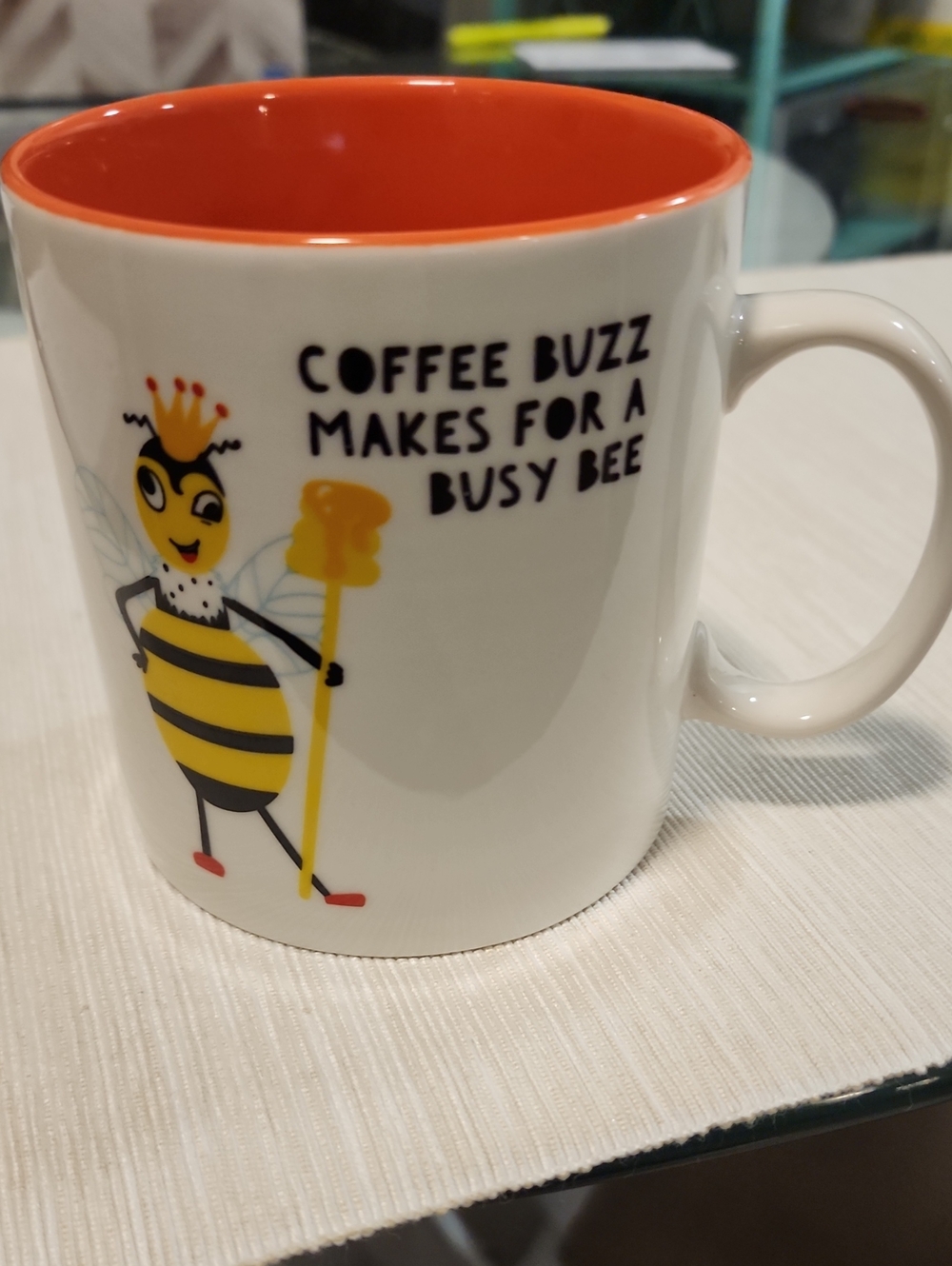 Bee-Themed Ceramic Coffee Mug with Orange Interior, 17 Oz.